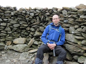 Sitting in the summit shelter on Moel Eilio in Snowdonia National Park