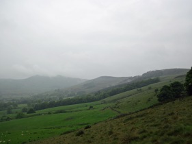 The Mam Tor ridge in cloud and rain.