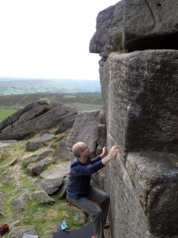 Trying to climb Gribble Nipple (V1 5b) at Stanage Far Right.